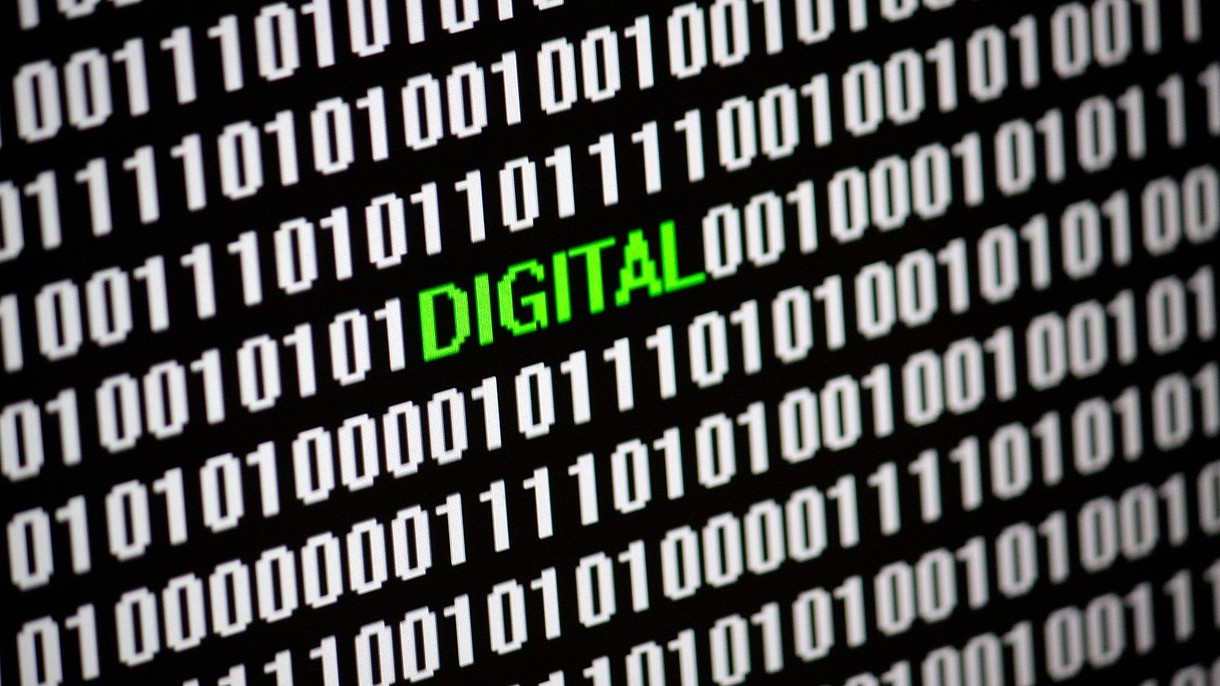 © 360b / Alamy Stock Foto Lines of computer codes are interrupted by the word "Digital" in green letters.