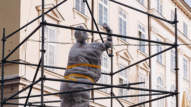  Statue wrapped in protective material.