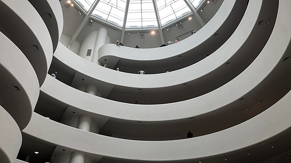 Photo taken from frog perspective of the inside of the Guggenheim Museum, showing the different floors.